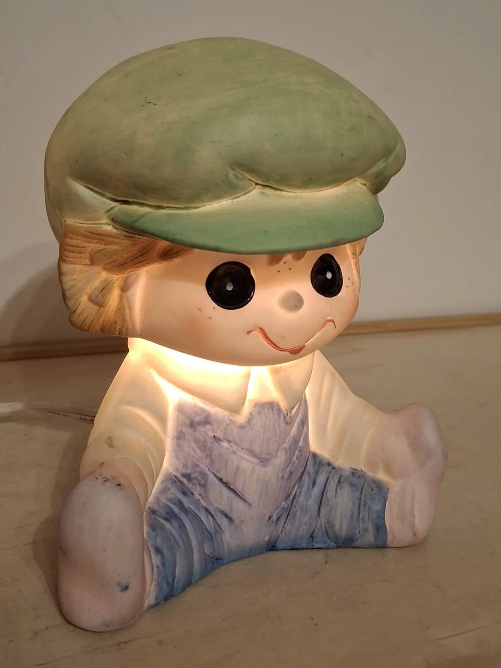 Vintage ceramic Interpur boy night light, green cap, blue overalls, works great